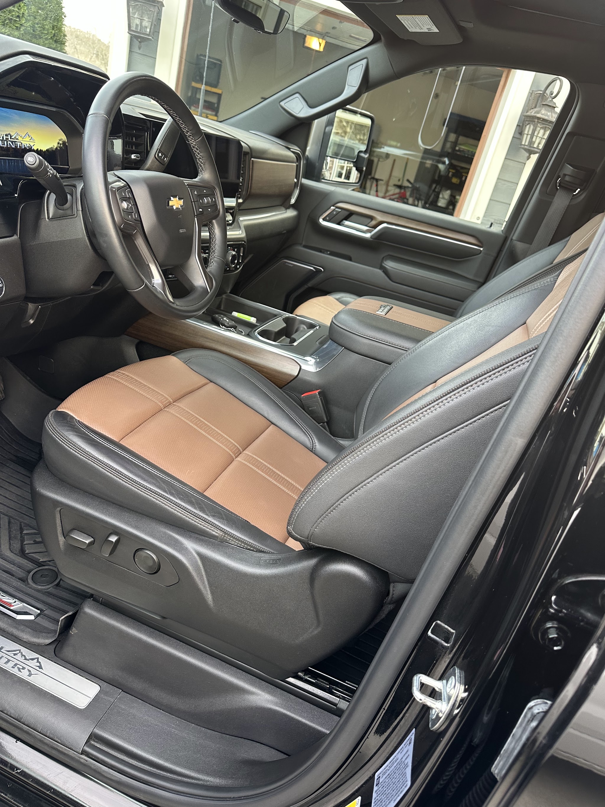 Clean leather interior of a Chevrolet truck with tan and black seats